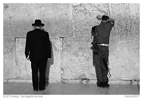 Orthodox Jew and soldier at the Western Wall. Jerusalem, Israel (black and white)