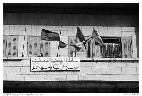 Palestinian flags and inscriptions in arabic in front of a school, East Jerusalem. Jerusalem, Israel