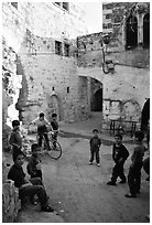 Group of children in old street, Hebron. West Bank, Occupied Territories (Israel) ( black and white)