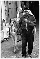 Arab man leading a donkey, Hebron. West Bank, Occupied Territories (Israel) (black and white)