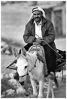 Arab man riding a donkey, Hebron. West Bank, Occupied Territories (Israel) (black and white)