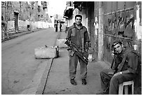 Two young israeli soldiers manning a checkpoint, Hebron. West Bank, Occupied Territories (Israel) ( black and white)