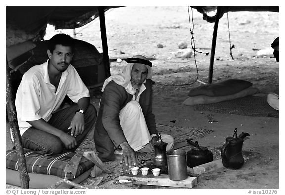 Bedouin men offering tea in a tent, Judean Desert. West Bank, Occupied Territories (Israel)