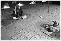 Bedouin man sitting on a carpet in a tent, Judean Desert. West Bank, Occupied Territories (Israel) ( black and white)