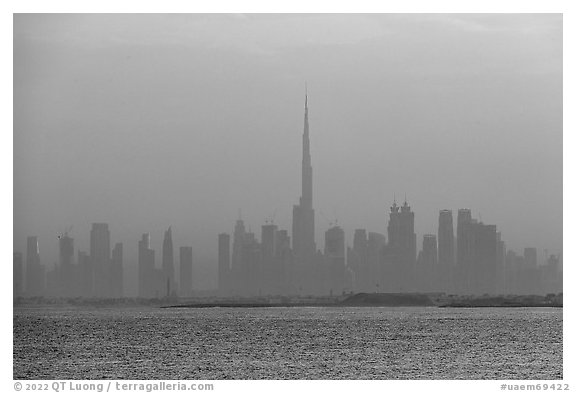 Dubai skyline with Burj Khalifa above Persian Gulf, sunrise. United Arab Emirates (black and white)