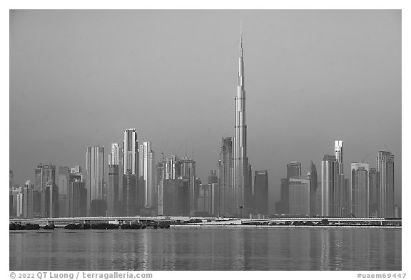 Dubai skyline with Burj Khalifa reflected in Dubai Creek. United Arab Emirates (black and white)
