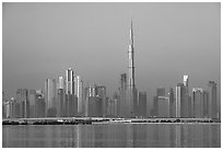 Dubai skyline with Burj Khalifa reflected in Dubai Creek. United Arab Emirates ( black and white)