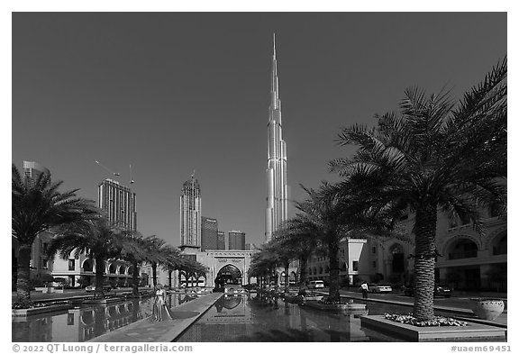 Model and Burj Khalifa from reflecting pool. United Arab Emirates (black and white)