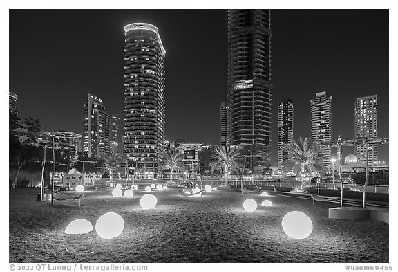 Park along Marina Promenade at night. United Arab Emirates (black and white)