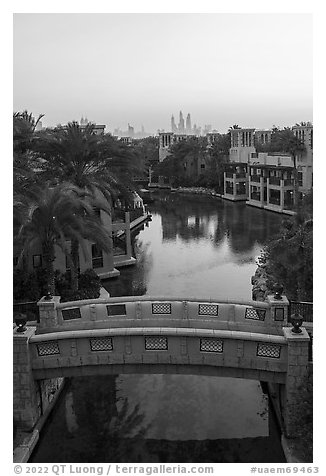 Medina Jumerah bridge over canal and city skyline. United Arab Emirates (black and white)