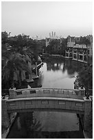 Medina Jumerah bridge over canal and city skyline. United Arab Emirates ( black and white)