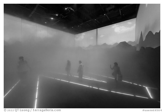 Visitors walk in Swizerland Pavilion fog. Expo 2020, Dubai, United Arab Emirates (black and white)