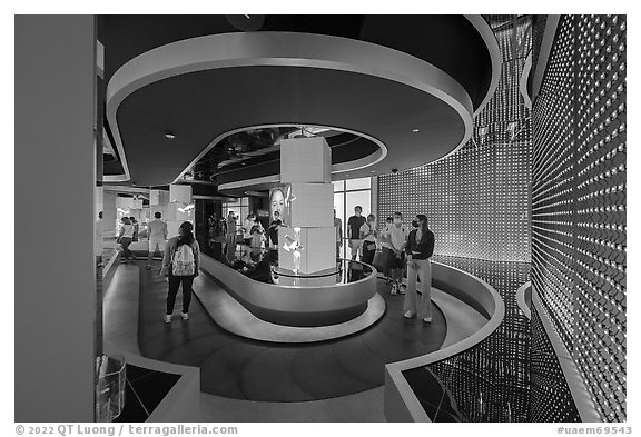 Visitors on moving walkway, Exhibit 3, USA Pavilion. Expo 2020, Dubai, United Arab Emirates (black and white)