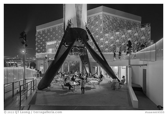 Booster rocket on landing legs and pavilion, USA Pavilion. Expo 2020, Dubai, United Arab Emirates (black and white)