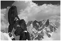 Alpinists on a pinacle of Aiguille du Midi after climbing the South Face. Alps, France (black and white)