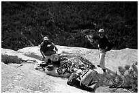 Sorting the gear at the top of the wall. El Capitan, Yosemite, California (black and white)