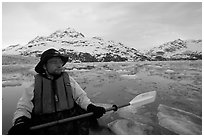 Kayaker on ice-chocked waters close to John Hopkins Inlet. Glacier Bay National Park, Alaska (black and white)