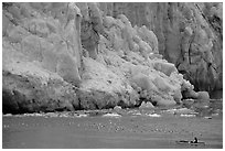 Kayaker bellow  the front of Lamplugh Glacier. Glacier Bay National Park, Alaska (black and white)