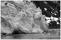 Kayaker paddling bellow Lamplugh Glacier. Glacier Bay National Park, Alaska (black and white)