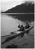 Kayakers in Hugh Miller Inlet. Glacier Bay National Park, Alaska (black and white)
