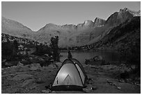 Tent with light and Palisades at dusk, lower Dusy Basin. Kings Canyon National Park ( black and white)