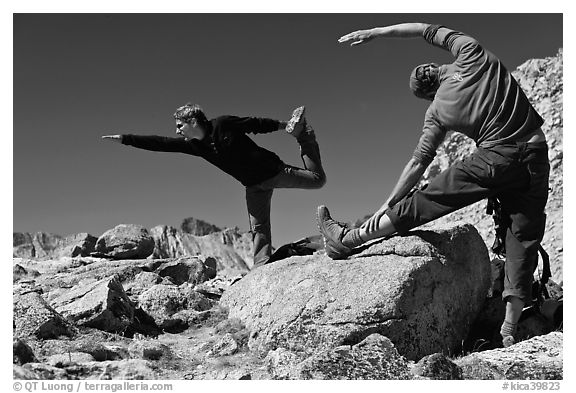 Hikers doing stretching exercises, Bishop Pass. Kings Canyon National Park, California