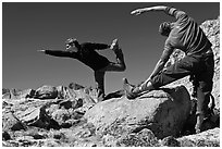 Hikers doing stretching exercises, Bishop Pass. Kings Canyon National Park, California (black and white)