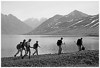 Group of hikers on the shores of Turquoise Lake. Lake Clark National Park, Alaska (black and white)