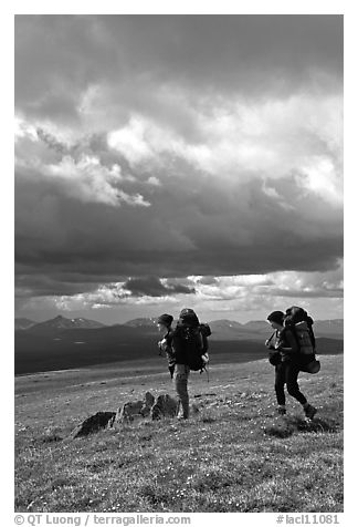 Backpackers seen from the side in the tundra. Lake Clark National Park, Alaska
