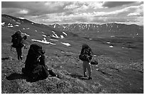 Backpackers take a pause when arriving on sight of Twin Lakes. Lake Clark National Park, Alaska (black and white)