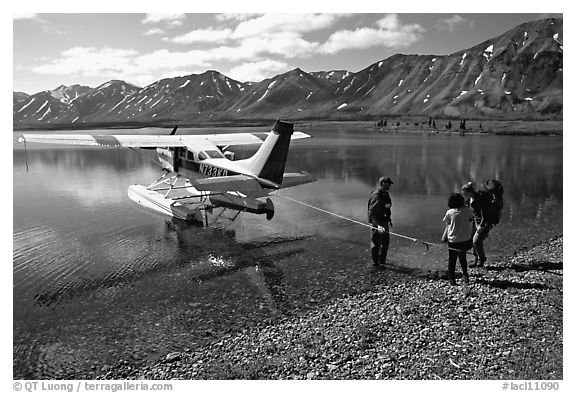 Backpackers being picked up by floatplane at Twin Lakes. Lake Clark National Park, Alaska