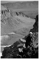 Woman gearing up to climb  East face of Mt Whitney. Sequoia National Park, California (black and white)