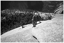 Rock climbers on the Snake Dike route, Half-Dome. Yosemite National Park, California (black and white)