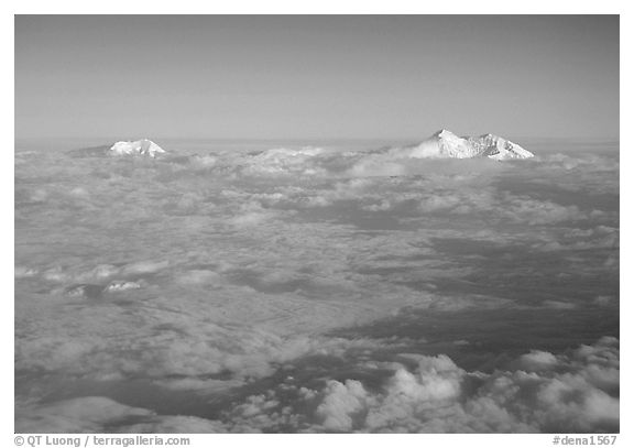 Summit of Mt Foraker and Mt Mc Kinley emerging from  clouds. Denali National Park (black and white)