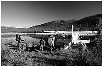 Backpackers beeing picked up by a floatplane at Circle Lake. Gates of the Arctic National Park, Alaska (black and white)