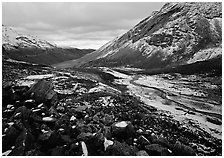 Boulders, valleys and slopes with fresh snow in cloudy weather. Gates of the Arctic National Park ( black and white)