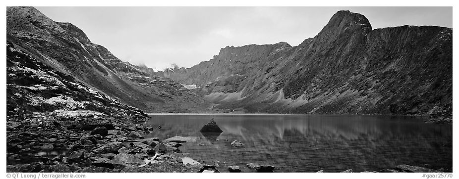 Mineral landscape with scree, rocky peaks, and lake. Gates of the Arctic National Park (black and white)