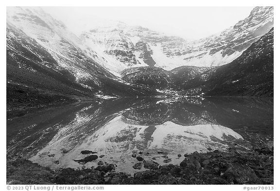 Snowy Three River Mountain reflected in lake. Gates of the Arctic National Park (black and white)