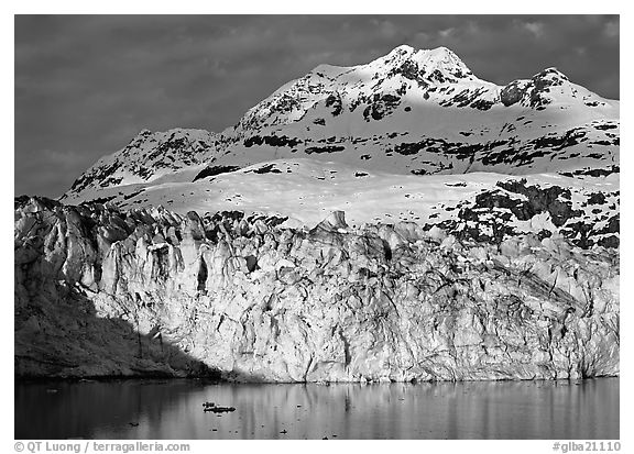 Face of Lamplugh Glacier illuminated by the sun on cloudy day. Glacier Bay National Park (black and white)
