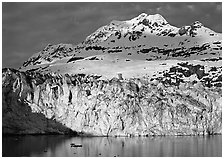 Face of Lamplugh Glacier illuminated by the sun on cloudy day. Glacier Bay National Park ( black and white)