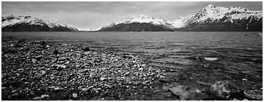 Snowy mountains rising above water. Glacier Bay National Park (Panoramic black and white)