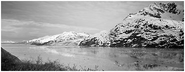Snowy mountains rising above fjord. Glacier Bay National Park (Panoramic black and white)
