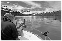 Man sitting at the bow of a small boat. Glacier Bay National Park ( black and white)