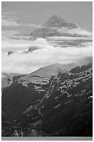 Pointed mountain with clouds hanging below. Glacier Bay National Park ( black and white)