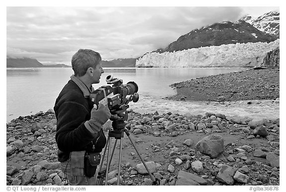 Cameraman filming in Tarr Inlet. Glacier Bay National Park (black and white)