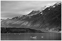 Slopes at the base of Mount Barnard illuminated by a late ray of sun. Glacier Bay National Park ( black and white)