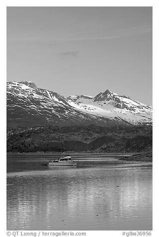 Small boat at the head of Tarr Inlet, early morning. Glacier Bay National Park (black and white)