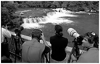 Photographers on observation platform and Brooks falls with bears. Katmai National Park ( black and white)