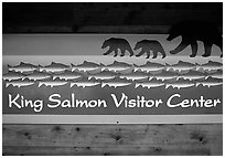 Bears and salmon on visitor center sign. Katmai National Park ( black and white)