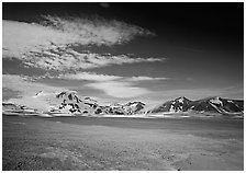 The desert-like floor of the Valley of Ten Thousand smokes is surrounded by snow-covered peaks such as Mt Meigeck. Katmai National Park ( black and white)